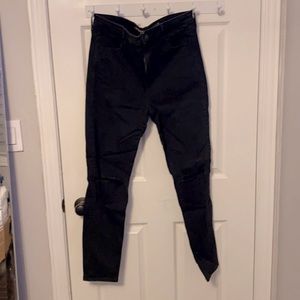Black high waisted jeans with knee distressing